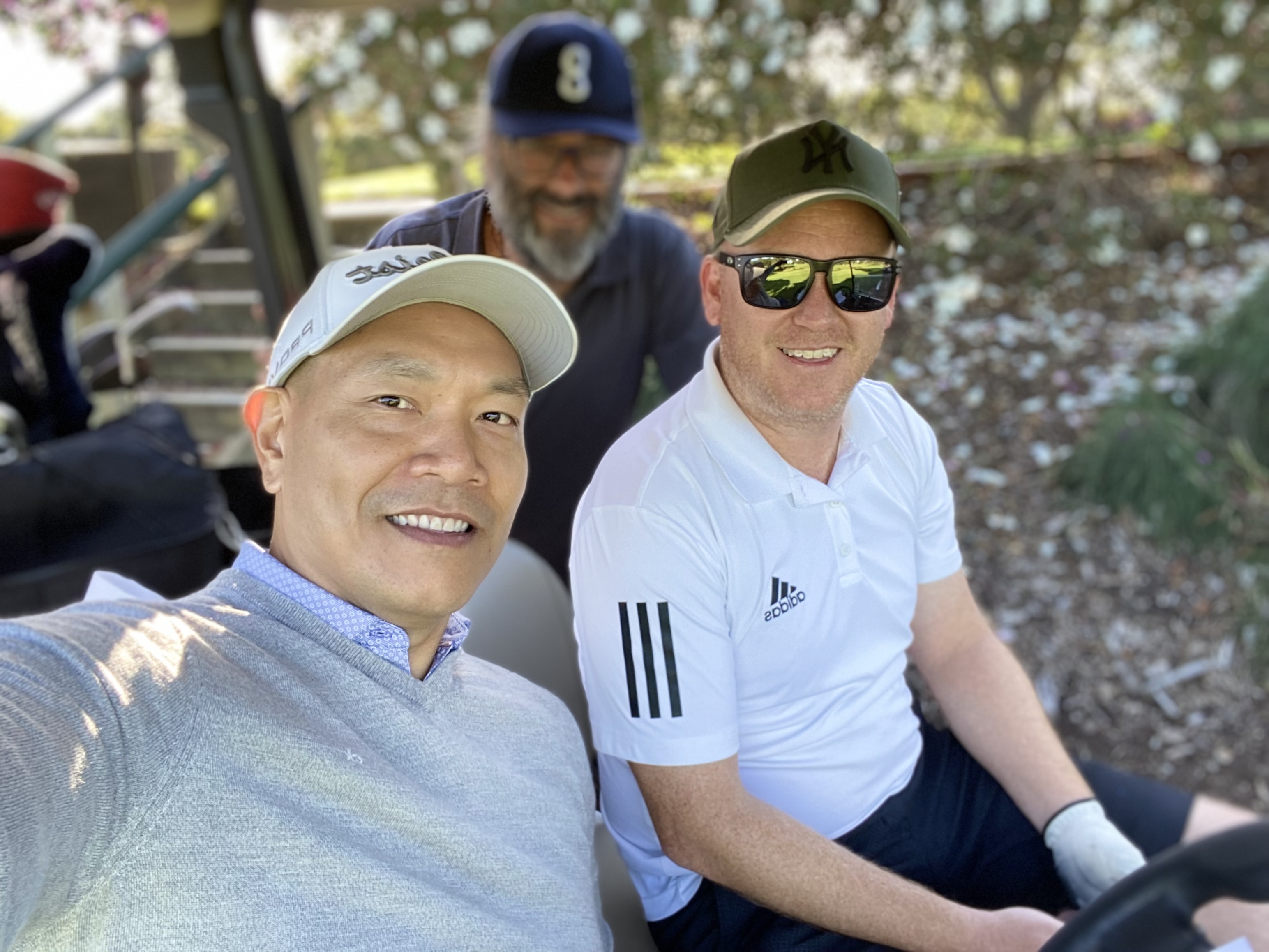 Team members playing golf at ASGA NSW Golf Event